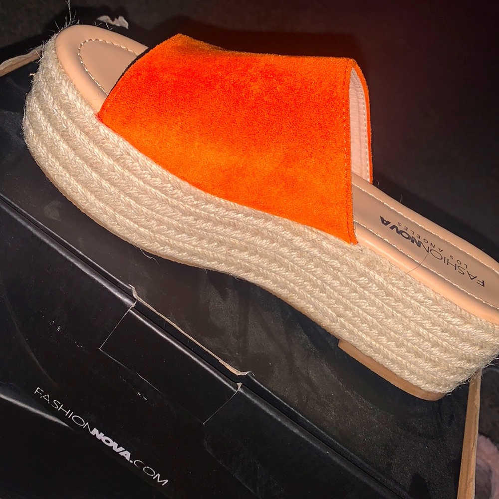Orange platform sandals.